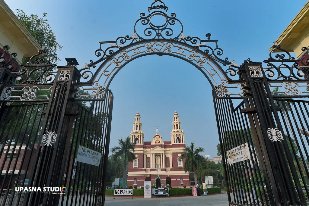 A church with a grand gate in front, inviting visitors to enter its sacred grounds.