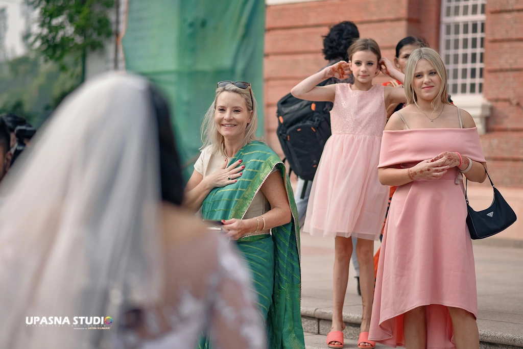Upasna studio | Wedding photographer in delhi | women standing  on wedding day.