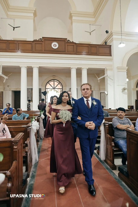 Wedding Photographers in Delhi | Upasna Studio | walks down the aisle in a church.